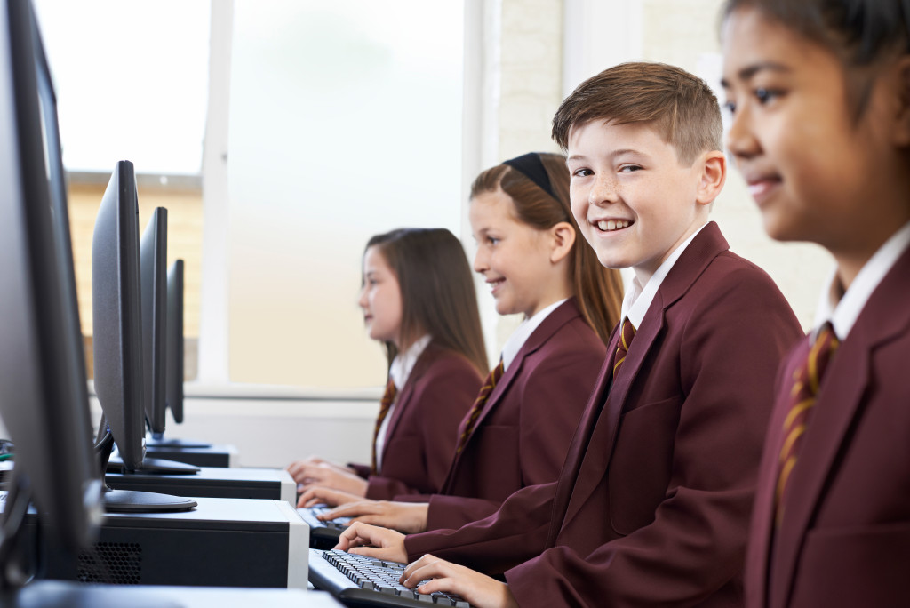children using computer in the school